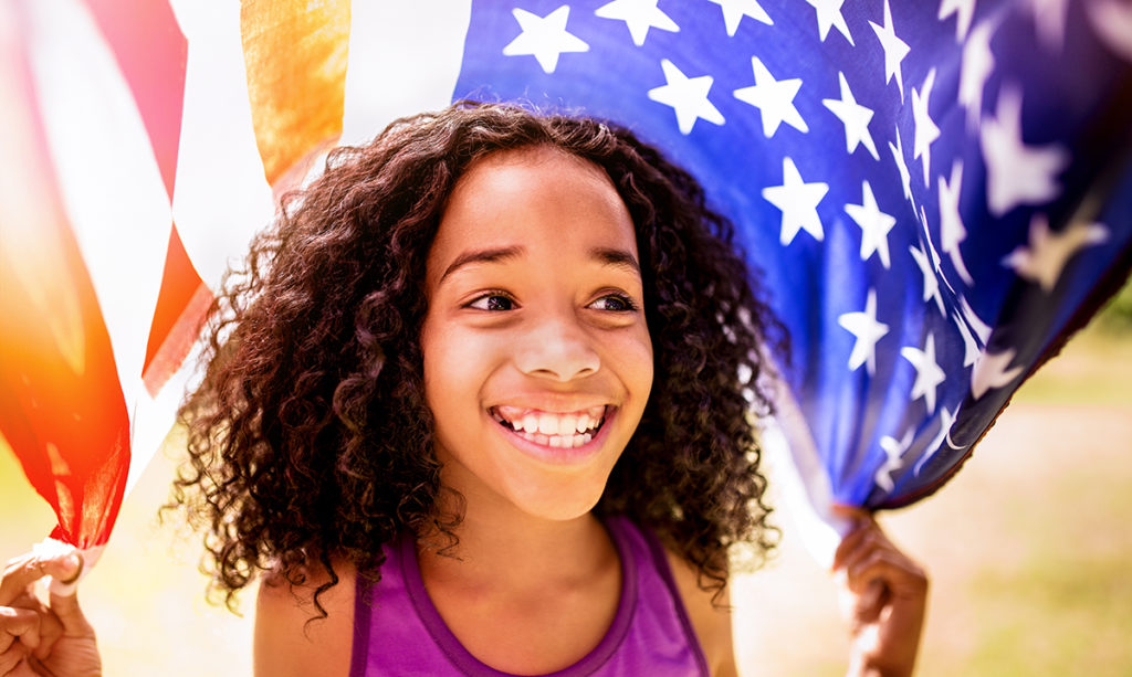 Young Black girl with an American flag