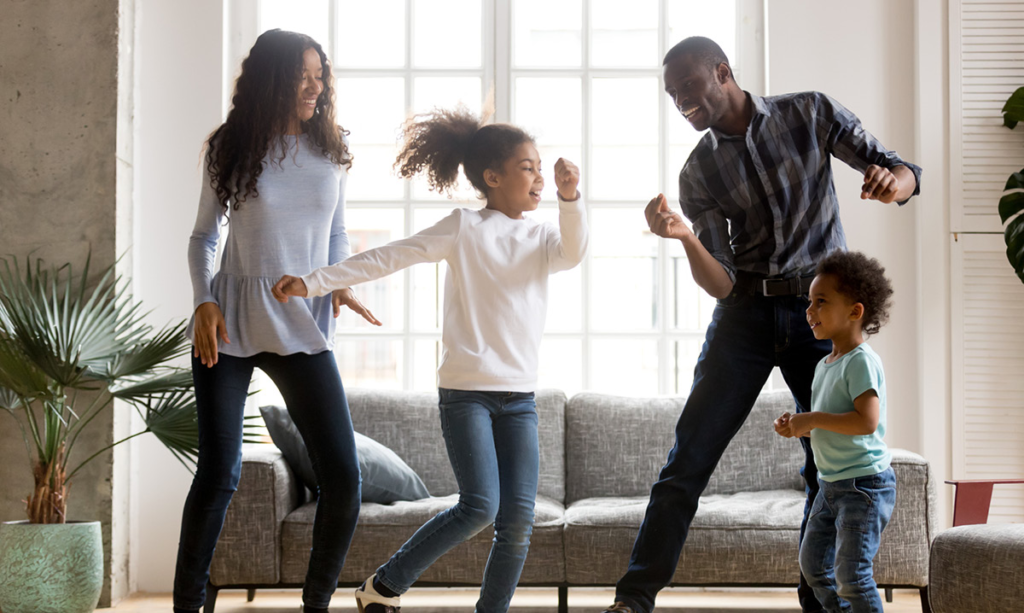 Family dancing in the living room